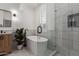 Serene bathroom with a soaking tub, glass-enclosed shower, and stylish modern finishes at 2634 E Tamarisk St, Gilbert, AZ 85296