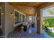 Cozy covered patio with comfortable seating and a stylish outdoor area at 2634 E Tamarisk St, Gilbert, AZ 85296