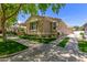 Charming single-story home featuring a well-manicured lawn and paved driveway at 2634 E Tamarisk St, Gilbert, AZ 85296