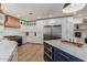 Spacious kitchen featuring white cabinets, stainless steel refrigerator, and a central island at 2634 E Tamarisk St, Gilbert, AZ 85296
