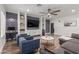 Stylish living room with custom built-ins and modern ceiling fan at 2634 E Tamarisk St, Gilbert, AZ 85296