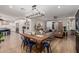 Open-concept living room with a wooden dining table and modern decor at 2634 E Tamarisk St, Gilbert, AZ 85296