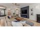 Comfortable living room featuring a large sectional sofa and modern fireplace at 2634 E Tamarisk St, Gilbert, AZ 85296