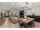 Open-concept living room with a wooden dining table and modern decor at 2634 E Tamarisk St, Gilbert, AZ 85296