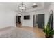 Main bedroom with a television, closet space, and access to spa-like bathroom at 2634 E Tamarisk St, Gilbert, AZ 85296