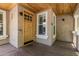 Inviting front porch with a custom wood door and stylish accents at 2634 E Tamarisk St, Gilbert, AZ 85296