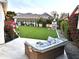 Beautiful backyard features manicured lawn, outdoor seating, and charming string lights at 2707 E James St, Gilbert, AZ 85296