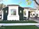 Charming home exterior with well-manicured greenery, a brick pathway and a clay tile roof at 2707 E James St, Gilbert, AZ 85296