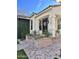 Inviting front porch with brick steps and an elegant door at 2707 E James St, Gilbert, AZ 85296