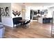 Open-concept kitchen and dining area with contemporary decor and hardwood floors at 2707 E James St, Gilbert, AZ 85296