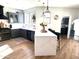 Bright, modern kitchen featuring a waterfall island, gray cabinetry, and stainless steel appliances at 2707 E James St, Gilbert, AZ 85296