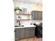 Functional laundry room with modern appliances, shelving, and stylish accents at 2707 E James St, Gilbert, AZ 85296