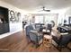 Open-concept living room with stylish seating and decor, hardwood flooring, and ample natural light at 2707 E James St, Gilbert, AZ 85296