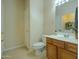 Bathroom with modern fixtures, tiled floors, and plenty of storage space at 2826 E Tracy Ln # 3, Phoenix, AZ 85032