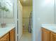 A quaint bathroom featuring dual sinks with wooden cabinets at 2826 E Tracy Ln # 3, Phoenix, AZ 85032