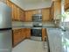 Well-lit kitchen with stainless steel appliances and modern granite countertops at 2826 E Tracy Ln # 3, Phoenix, AZ 85032
