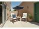 Cozy private patio with comfortable seating and shaded umbrella, perfect for relaxation at 2826 E Tracy Ln # 3, Phoenix, AZ 85032