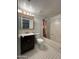 Well-lit bathroom featuring vanity with sink, mirror, and a shower/tub combo at 3738 W Danbury Dr, Glendale, AZ 85308
