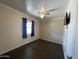 Empty bedroom with new tile flooring and a ceiling fan for added comfort at 3738 W Danbury Dr, Glendale, AZ 85308