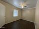 Bedroom featuring wood-look tile floors and a window at 3738 W Danbury Dr, Glendale, AZ 85308