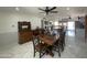 Spacious dining room featuring an antique hutch and an adjoining kitchen area with an eat-in island at 3738 W Danbury Dr, Glendale, AZ 85308