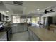 Well-lit kitchen featuring a stainless steel refrigerator, stove, and microwave with outdoor views at 3738 W Danbury Dr, Glendale, AZ 85308