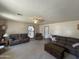 Comfortable living room showcasing neutral tones and a clear view into the kitchen area at 3738 W Danbury Dr, Glendale, AZ 85308