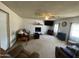 Relaxing living room setting including sofas, a fireplace with mantel and TV at 3738 W Danbury Dr, Glendale, AZ 85308