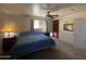 Comfortable bedroom featuring a ceiling fan, windows, and a cozy atmosphere at 3738 W Danbury Dr, Glendale, AZ 85308