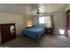 Comfortable bedroom featuring a ceiling fan, windows, and a cozy atmosphere at 3738 W Danbury Dr, Glendale, AZ 85308