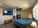 Comfortable bedroom featuring a ceiling fan, windows, and a cozy atmosphere at 3738 W Danbury Dr, Glendale, AZ 85308