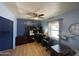 Well-lit office space with a desk, shelving, and a cozy atmosphere at 3738 W Danbury Dr, Glendale, AZ 85308