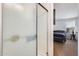 This bathroom features a shower with a frosted glass door and a view into the bedroom at 3840 W Abraham Ln, Glendale, AZ 85308