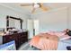 Bedroom with a dresser, mirror, ceiling fan and neutral colored walls at 3840 W Abraham Ln, Glendale, AZ 85308