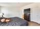 Cozy bedroom with a comfortable bed, modern dresser, mounted television and natural lighting at 3840 W Abraham Ln, Glendale, AZ 85308