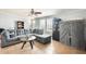 Comfortable living room featuring neutral colors, a ceiling fan, and natural light at 3840 W Abraham Ln, Glendale, AZ 85308
