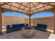 Outdoor seating area with fire pit and gazebo at 40470 W Agave Rd, Maricopa, AZ 85138