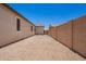 Gravel backyard with block fence at 40470 W Agave Rd, Maricopa, AZ 85138