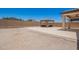 Gravel backyard with gazebo, and block fence for privacy at 40470 W Agave Rd, Maricopa, AZ 85138
