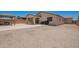 Spacious lot featuring a large gravel backyard, gazebo, and block wall at 40470 W Agave Rd, Maricopa, AZ 85138