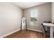 Bright bedroom features wood floors, neutral walls, and a window with natural light at 40470 W Agave Rd, Maricopa, AZ 85138