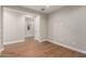 Light and airy bedroom with wood floors and a neutral color palette at 40470 W Agave Rd, Maricopa, AZ 85138