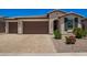 Beautiful home with a spacious three car garage and well-manicured landscaping at 40470 W Agave Rd, Maricopa, AZ 85138
