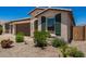 Charming home featuring a well-maintained yard and desert-friendly landscaping at 40470 W Agave Rd, Maricopa, AZ 85138
