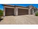 Lovely home featuring a spacious three-car garage and a paved driveway at 40470 W Agave Rd, Maricopa, AZ 85138