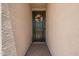Inviting front entrance with a stylish black door, decorative wreath, and a brick walkway at 40470 W Agave Rd, Maricopa, AZ 85138