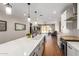 Spacious kitchen with an open layout, featuring modern appliances and a view of the living area at 40470 W Agave Rd, Maricopa, AZ 85138