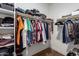 Walk-in closet featuring ample shelving and clothing racks for maximum storage at 40470 W Agave Rd, Maricopa, AZ 85138