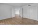Bright bedroom with light wood floors and double door closet at 4200 N Miller Rd # 325, Scottsdale, AZ 85251