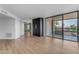 Open room with a large closet and glass doors leading to a balcony at 4200 N Miller Rd # 325, Scottsdale, AZ 85251